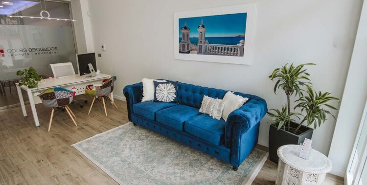 Blue sofa and reception area Albir office Real Estate Solicitor Costa Blanca